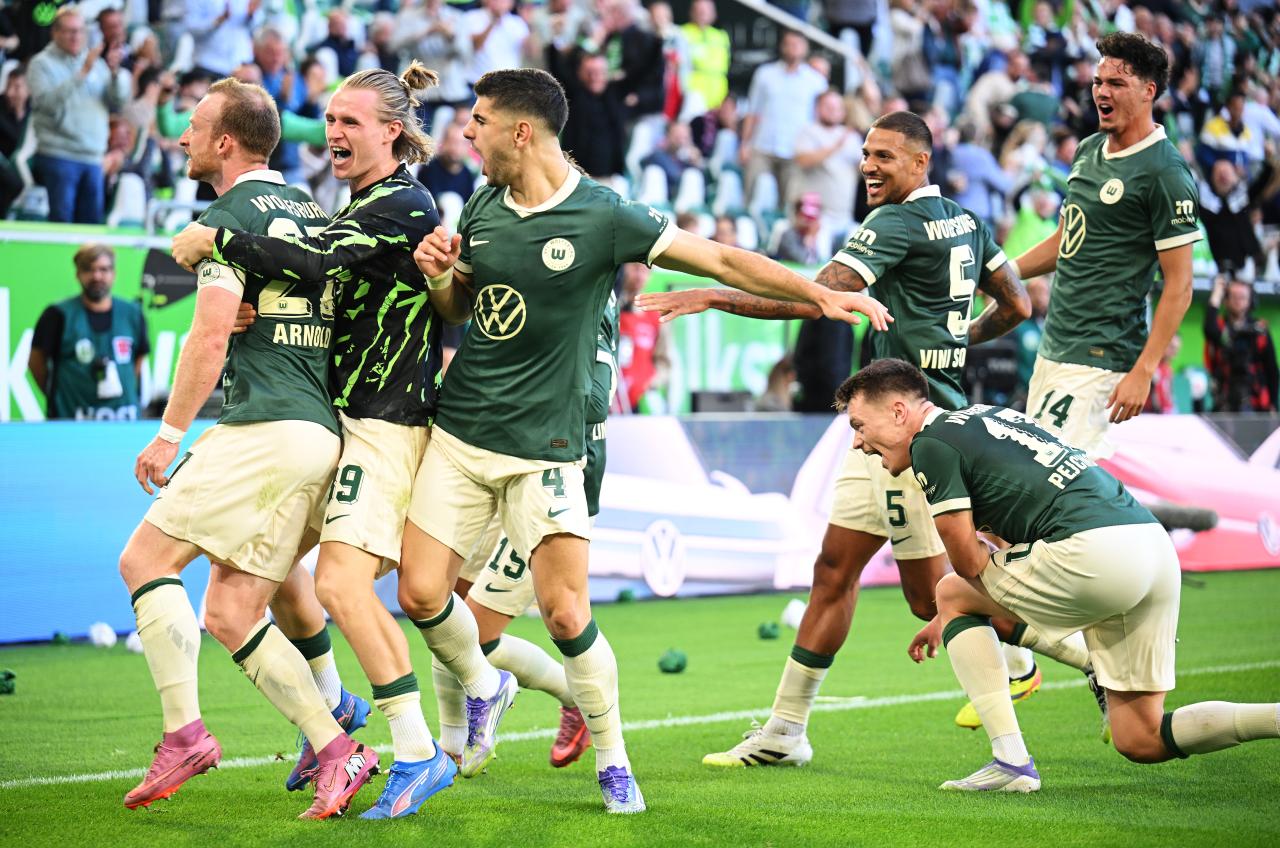 Thunder, pyro, and late drama: Wolfsburg and Köln split points in Bundesliga thriller