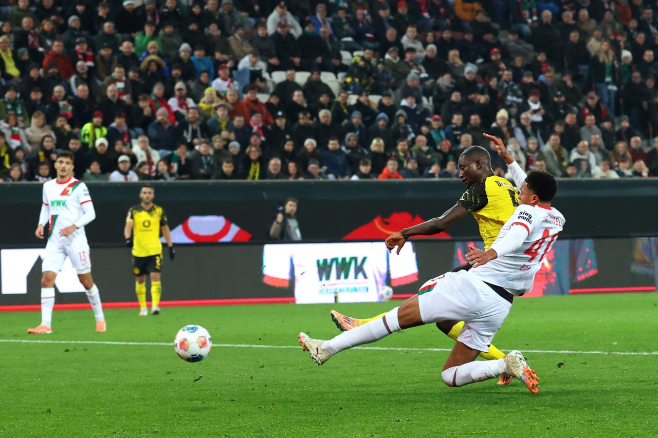 Guirassy goal gives Dortmund the edge in arm-wrestle with Augsburg