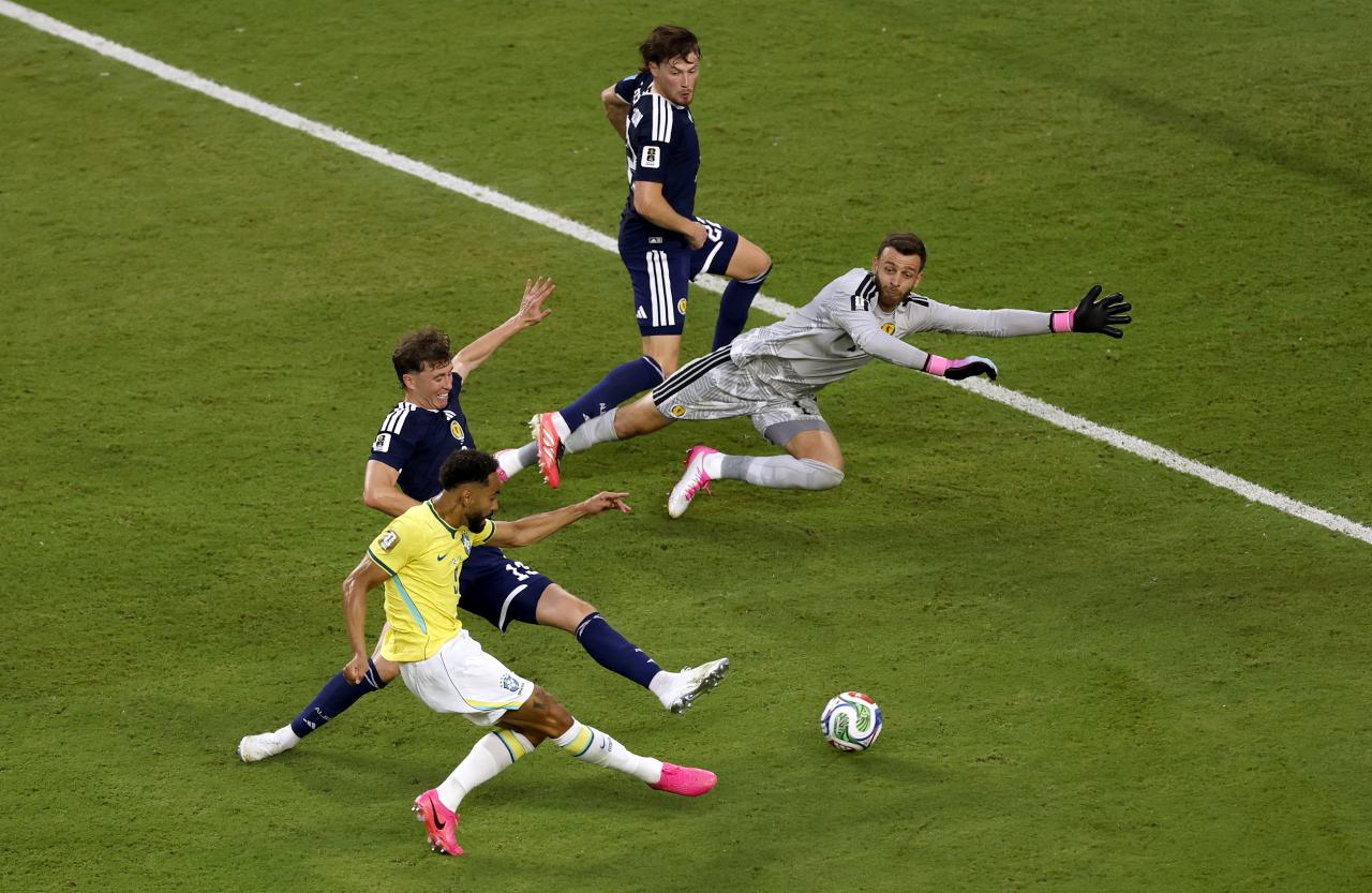 World Cup: Brazil crowned Group C winners as Scotland face nervous wait