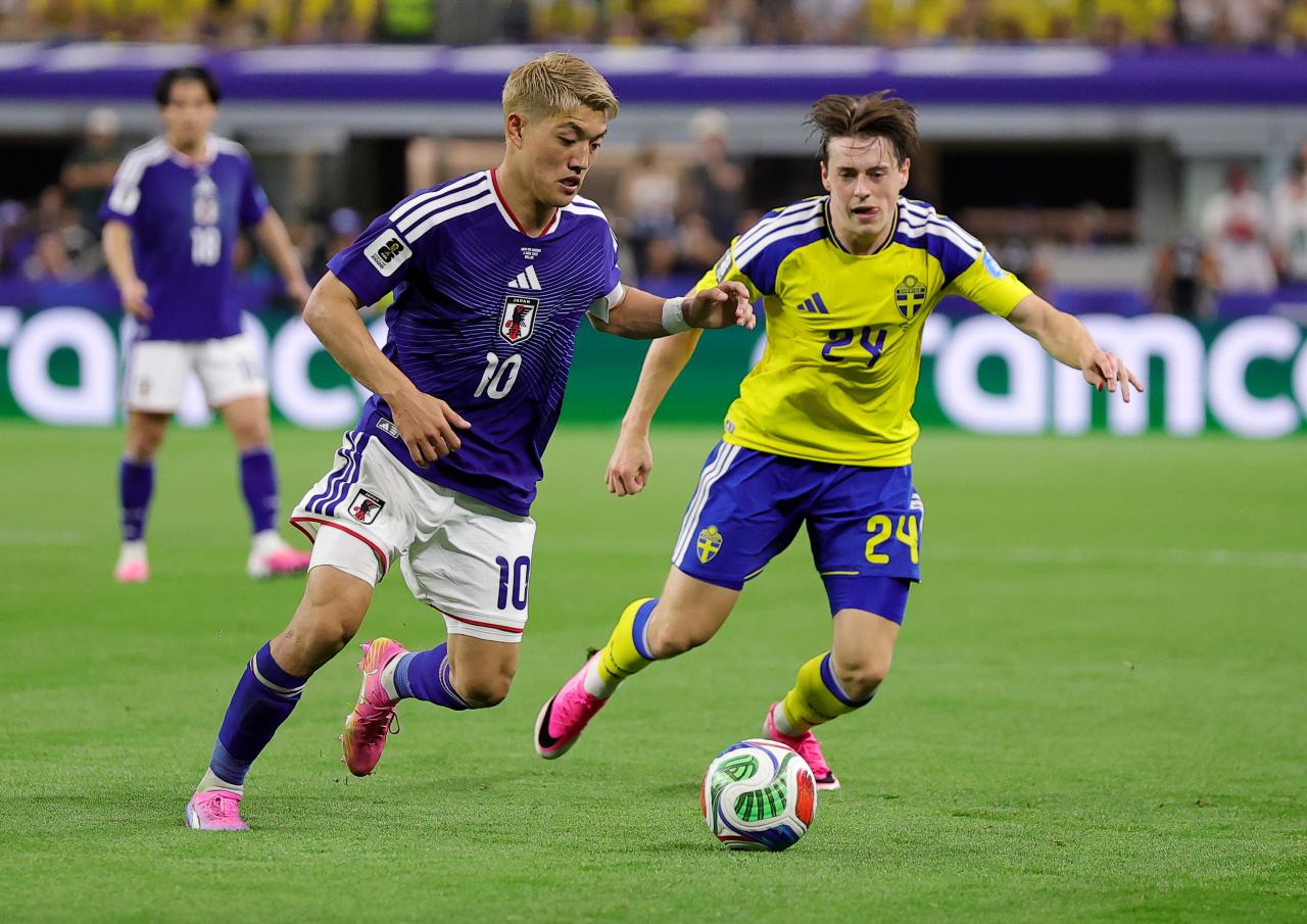 World Cup: Japan and Sweden share spoils to advance from Group F