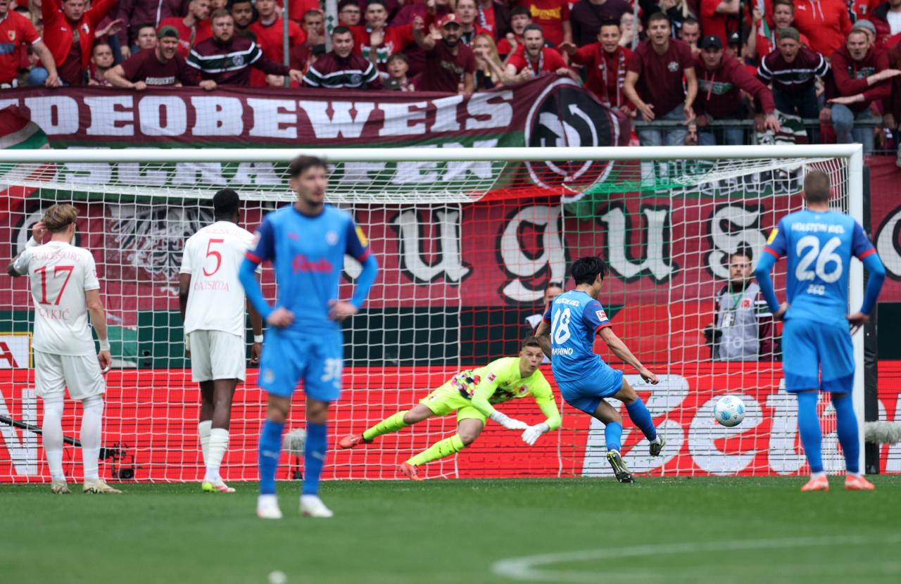 Kiel stun Augsburg to reignite survival hopes