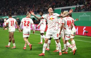 Benjamin Sesko celebrates his penalty to put Leipzig in the lead against Wolfsburg.