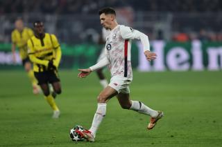 Thomas Meunier runs the ball for Lille OSC in their Champions League match in Dortmund, 4. March 2025.