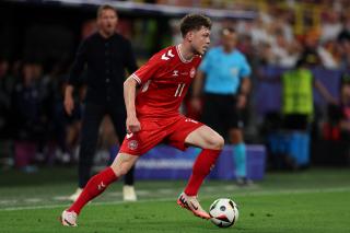 Denmark's Andreas Skov Olsen runs the ball against Germany in their UEFA EURO 2024 knockout match, 29. June 2024.