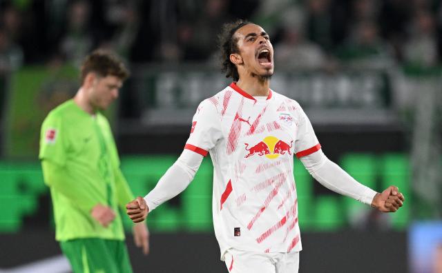 Yussuf Poulsen celebrates victory after the Bundesliga match between VfL Wolfsburg and RB Leipzig