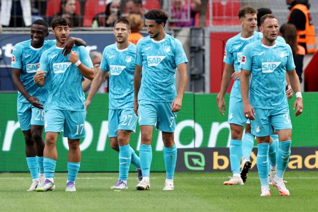 Hoffenheim celebrate after scoring against Bayer Leverkusen.
