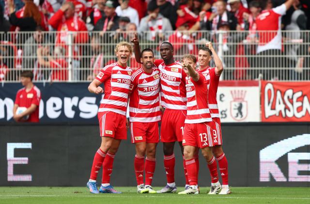 Union Berlin players celebrate after Ilyas Ansah's goal against VfB Stuttgart, 23. August 2025.