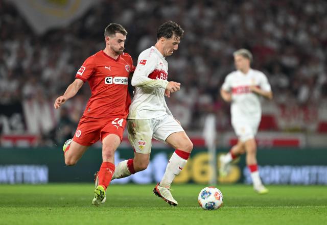 Angelo Stiller battles with Conor Metcatle.