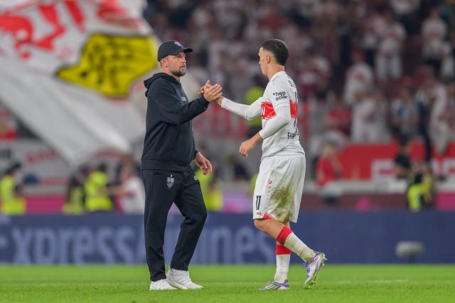 Sebastian Hoeneß shakes hands with Bilal El Khannouss following the win against St. Pauli.