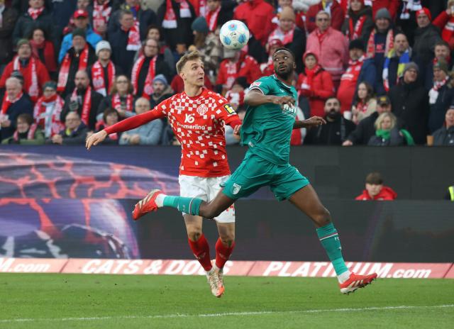  Nelson Weiper of Mainz (L) and Chrislain Matsima of Augsburg battle for the ball