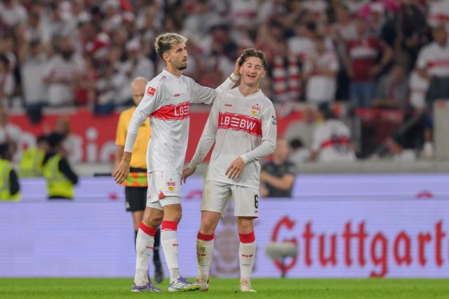 Atakan Karazor and Angelo Stiller react after Stuttgart's win against St. Pauli.