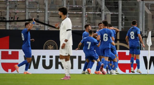 Greece players celebrate the opening goal by Konstantinos Kostoulas Greece players celebrate the opening goal by Konstantinos Kostoulas