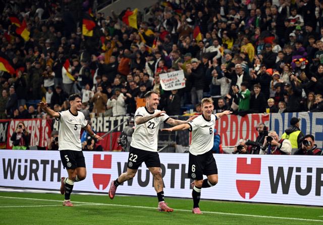 Germany players celebrating the win against Luxembourg.