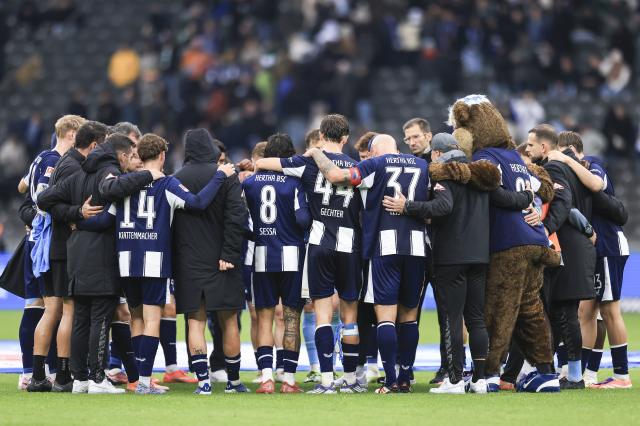 Players of Hertha BSC huddle