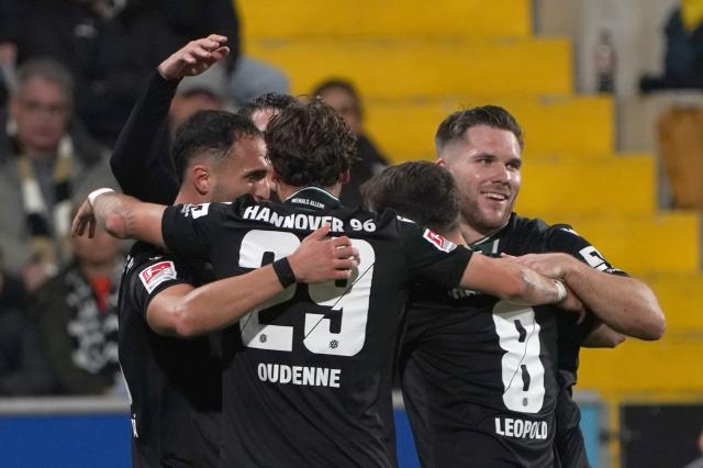 Hannover celebrate after Le Joncour’s own goal to make it 1-1