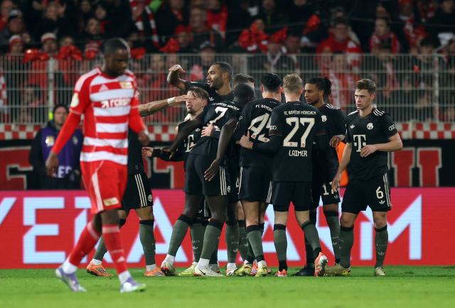FC Bayern fans celebrating their win in the DFB Pokal against Union Berlin.
