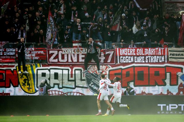 RB Leipzig players celebrating infront of their fans.