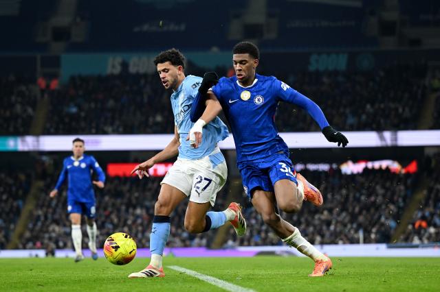 Josh Acheampong defending for Chelsea.