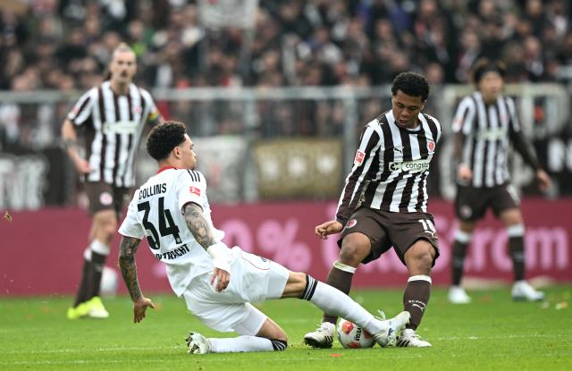 Joel Chima Fujita (FCSP) is tackled by Nnamdi Collins (SGE) - 08 Mar 2026