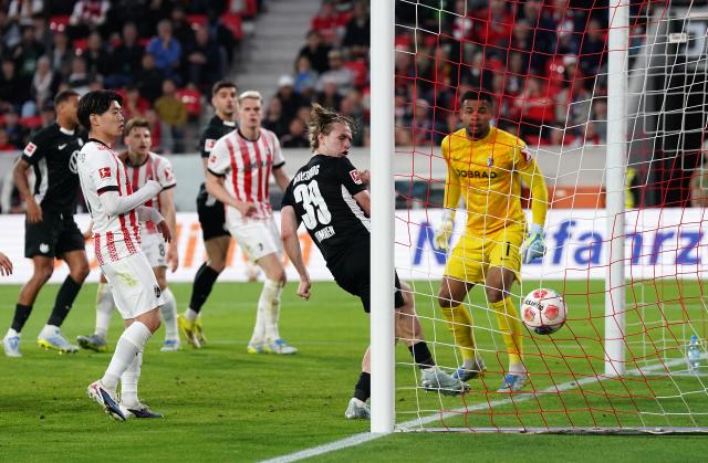 Konstantinos Koulierakis, in the background, looks on as his header leads to the VfL Wolfsburg opening goal, 3. May 2026.