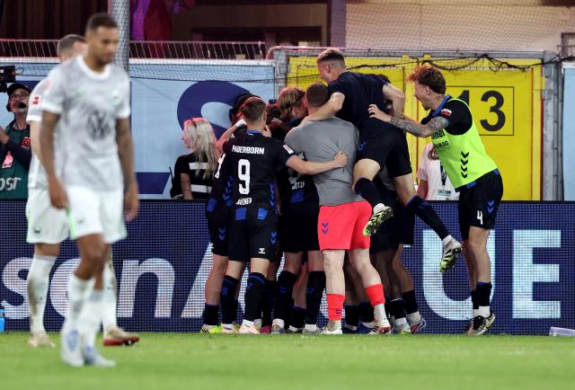 SC Paderborn 07 players celebrate Laurin Curda's goal in extra time against VfL Wolfsburg, 25. May 2026.