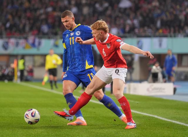 Nicolas Seiwald (right) battles for the ball with Bosnia and Herzegovina forward Edin Džeko.