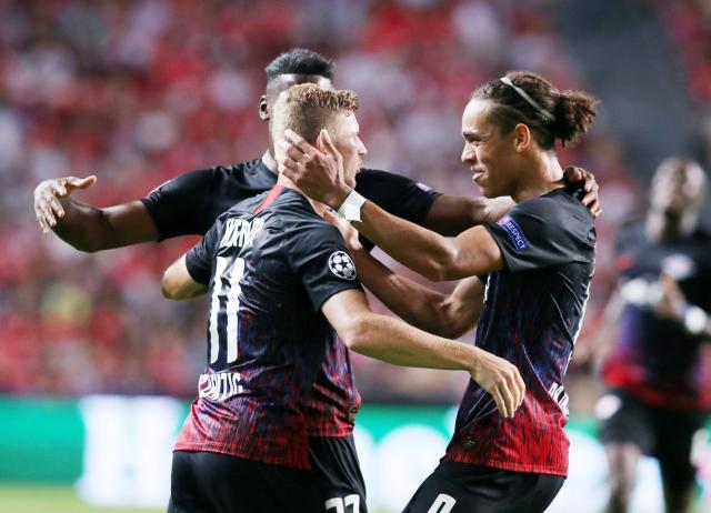 Timo Werner celebrates with his teammates after scoring against Benfica.