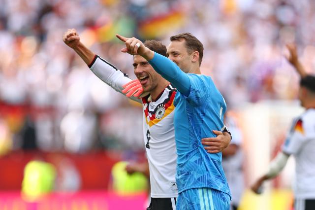 Leon Goretzka with Manuel Neuer.