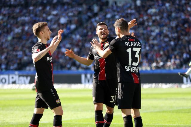 Mitchel Weiser, Kevin Volland and Lucas Alario celebrate.