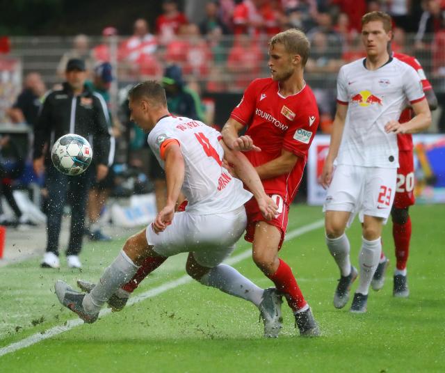 Willi Orban and Sebastian Andersson battle for the ball.