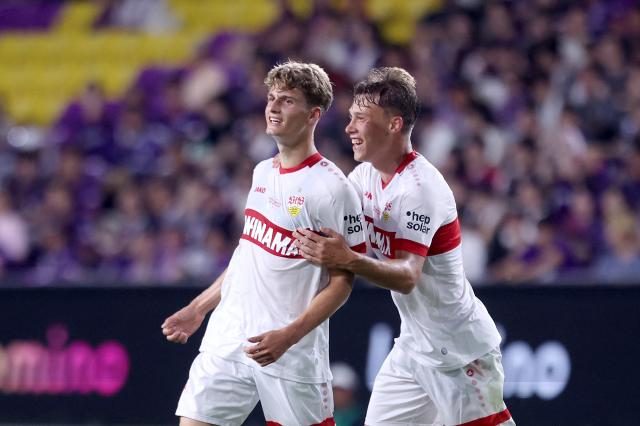 Christopher Oliver (R) with Luca Raimund in Stuttgart's 2024 Asia tour 
