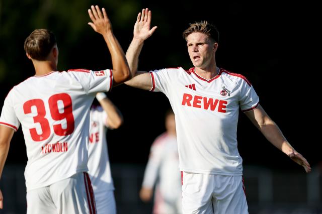 Köln players celebrating.