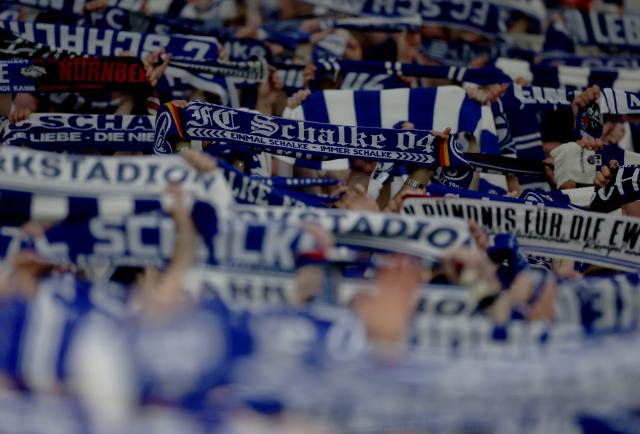 FC Schalke 04 supporters raise their scarves following the match against Fortuna Düsseldorf, 2. May 2026.