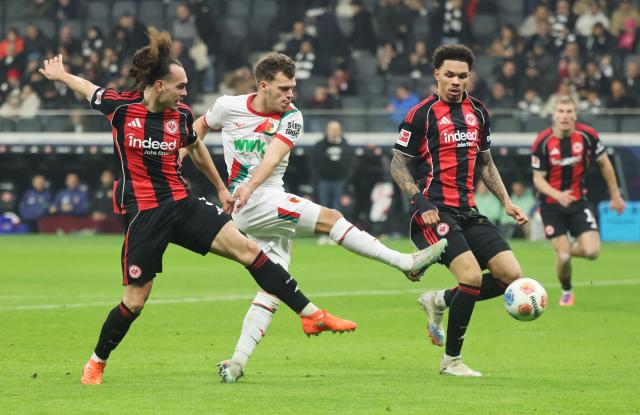 FC Augsburg's Robin Fellhauer takes a shot on goal against Eintracht Frankfurt, 13. December 2025.