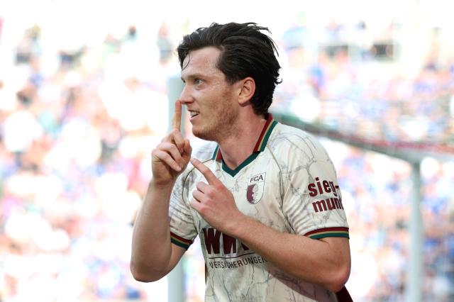 Michael Gregoritsch celebrates scoring for Augsburg.