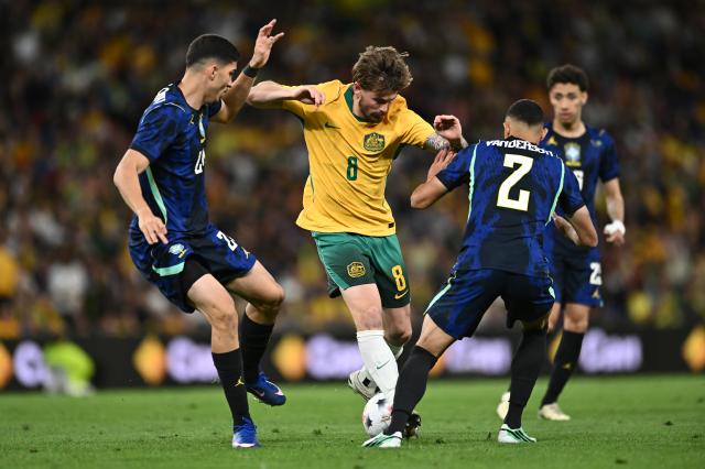 Metcalfe surrounded by Brazil stars