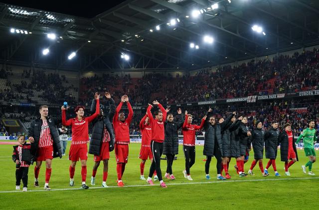 Freiburg celebrate following their victory against Schalke 