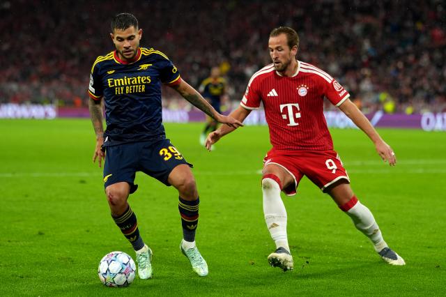 Arsenal midfielder Bruno Guimaraes shields the ball from Bayern Munich striker Harry Kane. Arsenal midfielder Bruno Guimaraes shields the ball from Bayern Munich striker Harry Kane.