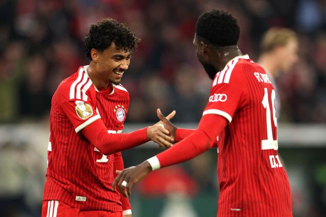 Nathaniel Brown and Alphonso Davies celebrating.