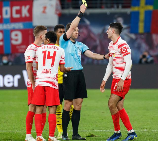 Dominik Szoboszlai is shown a yellow card.