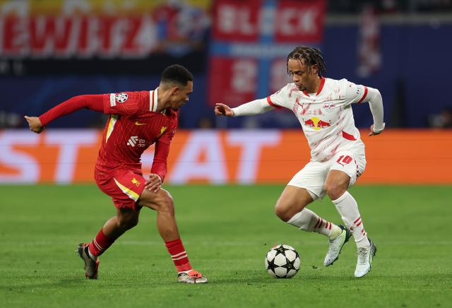 RB Leipzig's Xavi Simons takes on Trent Alexander-Arnold of Liverpool.