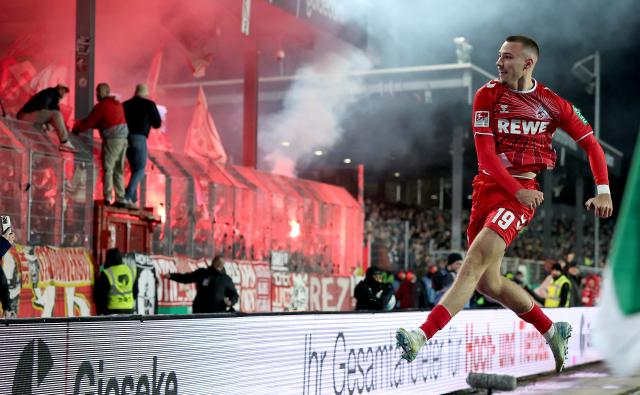 Tim Lemperle celebrates in front of Köln traveling supporters earlier this season. 