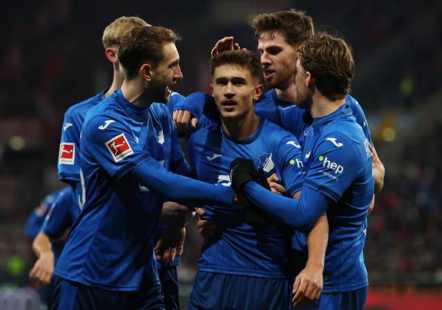 Tom Bischof celebrates with TSG teammates after drawing level with Freiburg on Sunday.