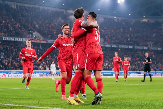 Vincenzo Grifo and Maximilian Eggestein celebrate with Lukas Kübler following his goal against Wolfsburg, 13. December 2024. Vincenzo Grifo and Maximilian Eggestein celebrate with Lukas Kübler following his goal against Wolfsburg, 13. December 2024.