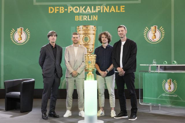 Bielefeld and Stuttgart representatives with Pokal trophy