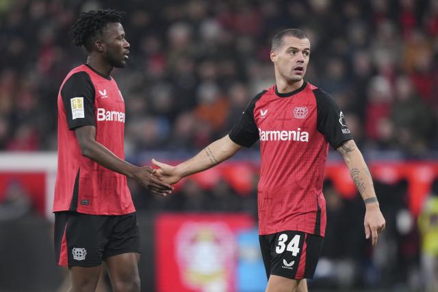 Edmond Tapsoba and Granit Xhaka for Leverkusen.